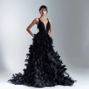 Create an gown black couture dress adorned with delicate feather...