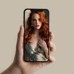 Generate an image showing a female hand holding a smartphone dis...