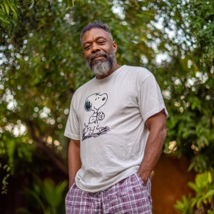 The image shows a 45 year old man muscle with a beard black hair...