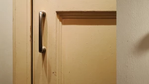one kitchen cabinet door with slightly dull paint and minor disc...