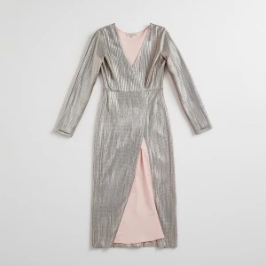 Create a minimalist flat lay composition with a couture silver s...