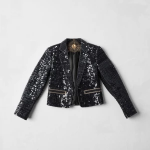 Create a minimalist flat lay composition with a couture sequin j...