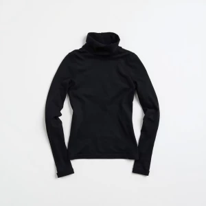 Produce an elegant flat lay image featuring a basic black turtle...