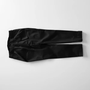 Create a minimalist flat lay composition with a classic Black sl...
