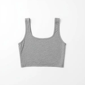 Produce an elegant flat lay image featuring a basic gray crop to...