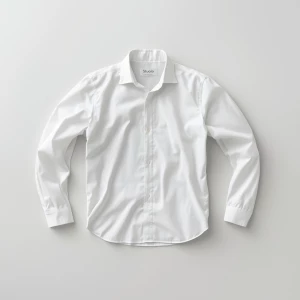 Create a minimalist flat lay composition with a classic white sh...