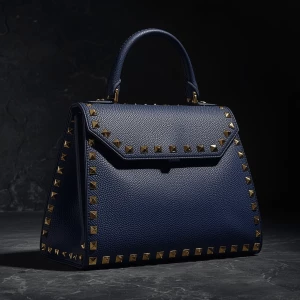 modern sculptural luxury handbag, structured geometric silhouett...