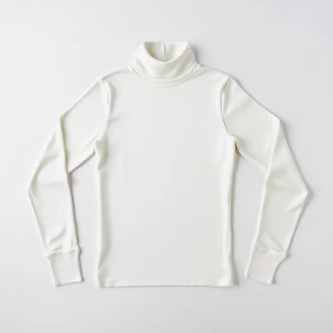 Produce an elegant flat lay image featuring a basic white turtle...