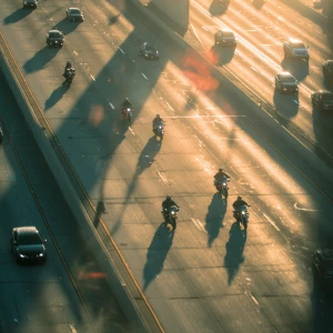 Motorcycle chase scene busy freeway drone shot
