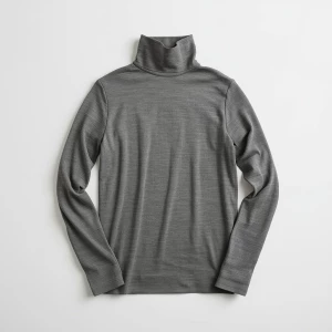 Produce an elegant flat lay image featuring a basic gray turtlen...