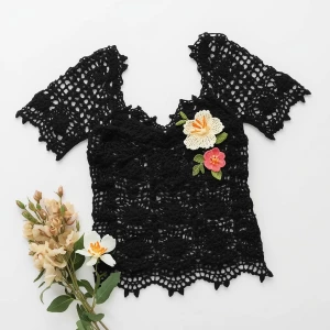 Create an elegant flat lay composition featuring a delicately ha...