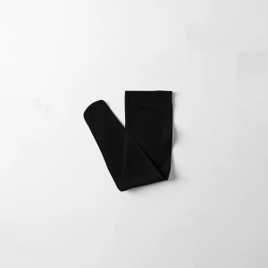 Create a minimalist flat lay composition with a pair of  black c...