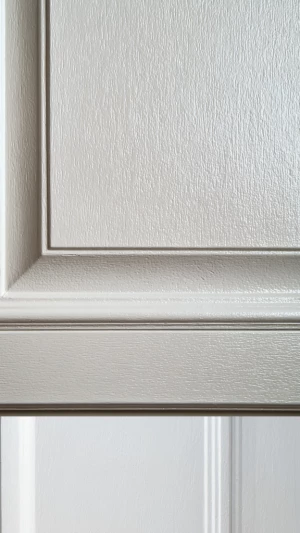 Capture a solitary kitchen cabinet door elegantly painted in a s...