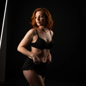 Please generate Image: Boudoir Model in Photostudio . Red haired...