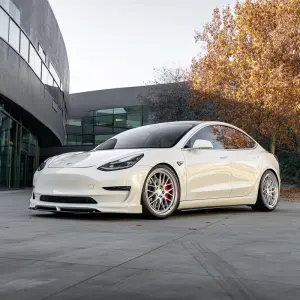 White tesla model 3 performance edition with bbs lm lowered