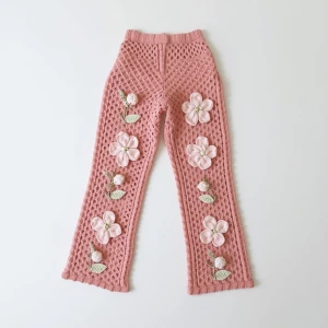 Create an elegant flat lay composition featuring a delicately ha...