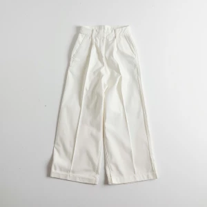 Create a minimalist flat lay composition with a classic white wi...